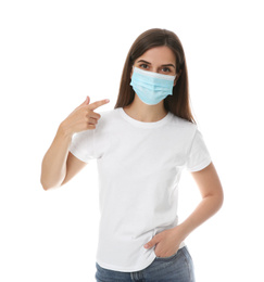 Female volunteer in mask on white background. Protective measures during coronavirus quarantine