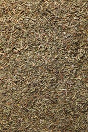 Aromatic dried basil as background, top view