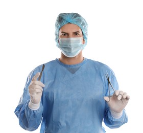 Doctor holding medical clamps and scalpel on light background. Surgical instruments