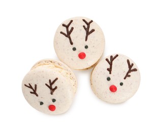 Photo of Tasty reindeer Christmas macarons on white background, top view