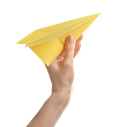 Woman holding yellow paper plane on white background, closeup