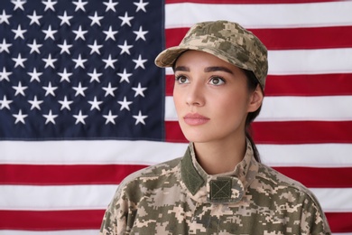 Female soldier in uniform against United states of America flag