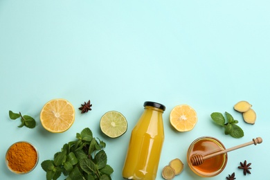 Flat lay composition with immunity boosting drink on light blue background. Space for text