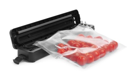Sealer for vacuum packing with plastic bag of cherry tomatoes on white background