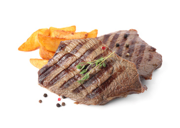 Delicious grilled beef steaks with fried potatoes isolated on white