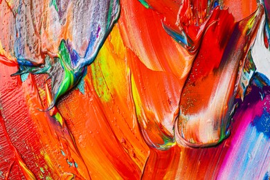 Strokes of colorful acrylic paints as background, closeup view