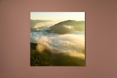 Canvas with printed photo of mountain landscape on pale brown wall