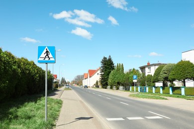 Traffic sign Pedestrian Crossing on city street