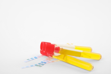 Test tubes with urine samples for analysis on white background
