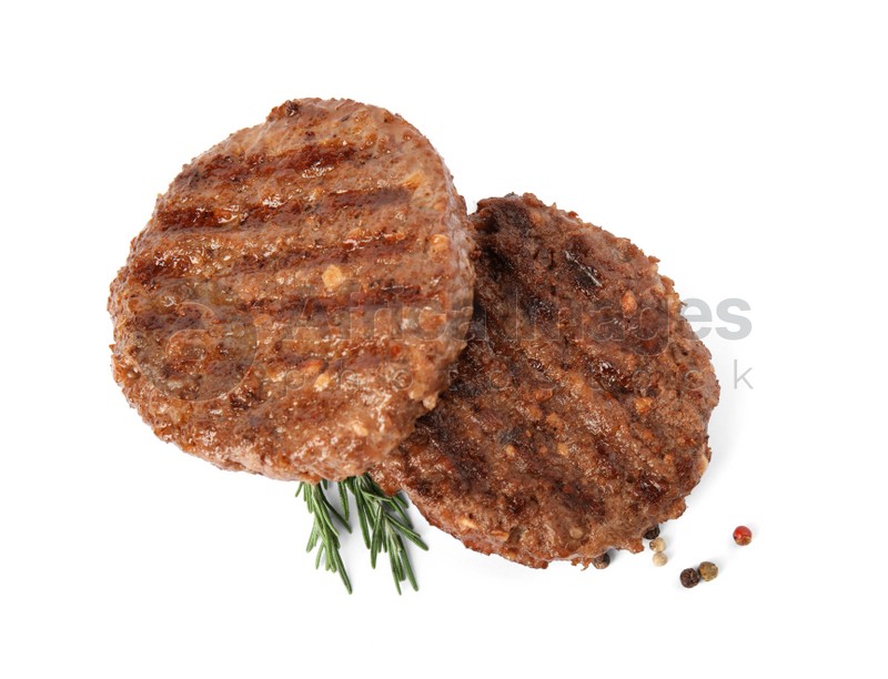 Grilled meat cutlets for burger isolated on white, top view