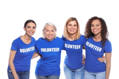 Team of female volunteers in uniform on white background