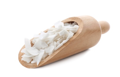 Wooden scoop with coconut flakes on white background