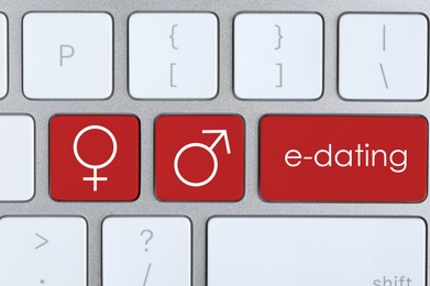 Love buttons on laptop keyboard, top view. Online dating site