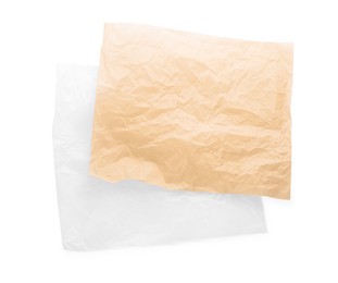 Sheets of crumpled baking paper on white background, top view