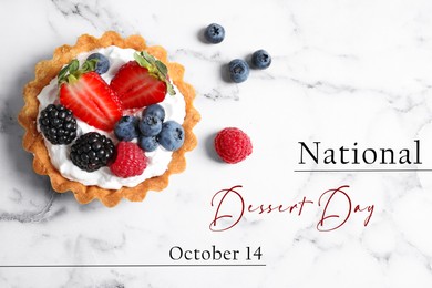 National Dessert Day, October 14. Tasty tartlet with different fresh berries on white marble table