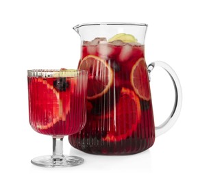 Glass and jug of Red Sangria isolated on white