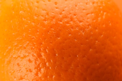Delicious unpeeled orange fruit as background, closeup