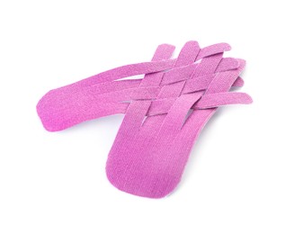 Violet kinesio tape pieces on white background