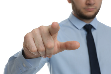 Businessman touching something against white background, focus on hand
