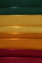 Different colorful napkins as background, top view