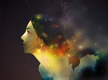 Double exposure of beautiful woman and starry sky with galaxies. Astrology concept