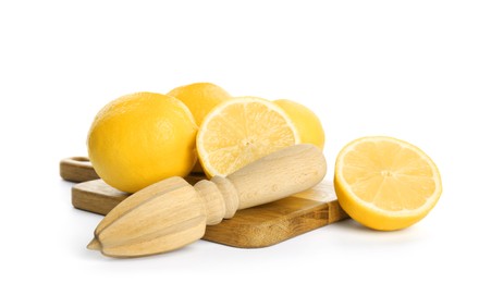Wooden juicer and fresh lemons on white background
