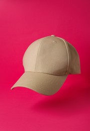 Baseball cap on pink background. Mock up for design