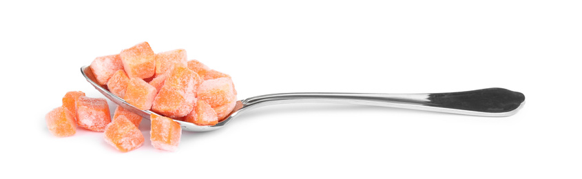 Frozen carrot in spoon isolated on white. Vegetable preservation