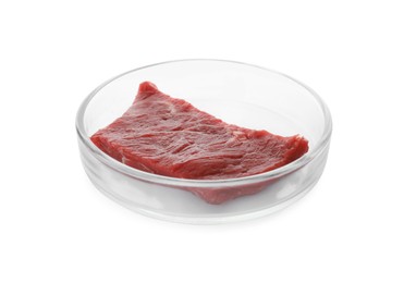 Petri dish with piece of raw cultured meat on white background