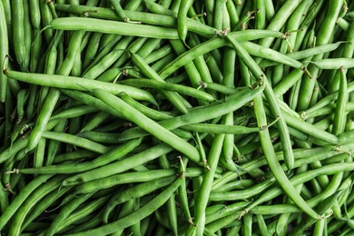 Fresh green beans as background, top view