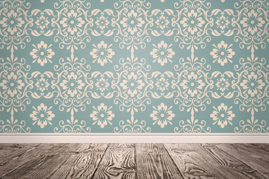 Blue wallpaper and wooden floor in room