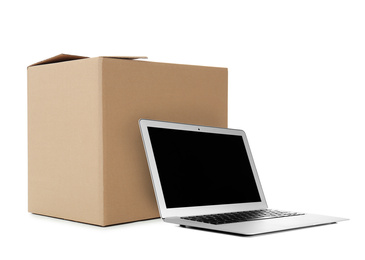 Online selling. Laptop and parcel on white background