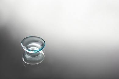 Contact lens on grey background