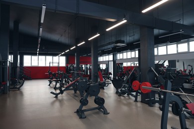 Photo of Spacious gym with professional equipment and mirrors