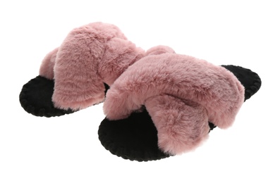 Pair of soft open toe slippers with pink fur on white background