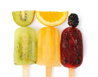 Photo of Delicious ice popsicles and fresh fruits on white background, top view