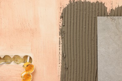 Tile and adhesive mix on wall, closeup
