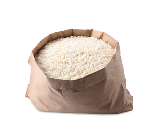 Uncooked rice in paper bag isolated on white