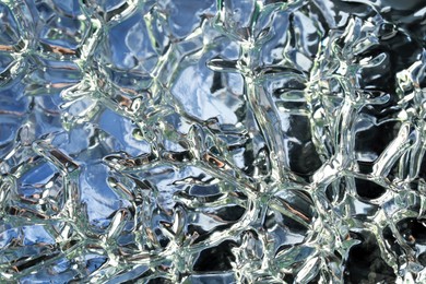 Beautiful transparent gel on silver background, closeup