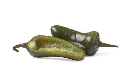 Photo of Whole and cut pickled green jalapenos on white background