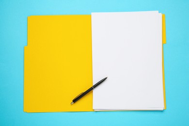 Yellow file with blank sheets of paper and pen on turquoise background, top view. Space for design