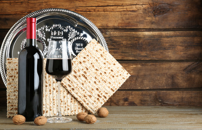 Composition with Passover matzos on wooden table, space for text. Pesach celebration