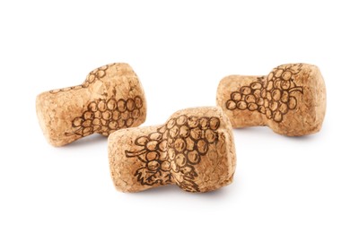 Sparkling wine corks with grape images on white background