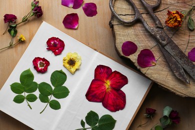 Photo of Flat lay composition with beautiful fresh and dried flowers on wooden table