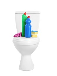 Photo of Toilet bowl and cleaning supplies on white background