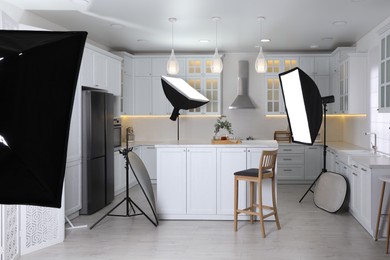 Photo of Professional photo studio equipment prepared for shooting kitchen interior