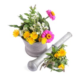 Photo of Mortar with different flowers and pestle on white background