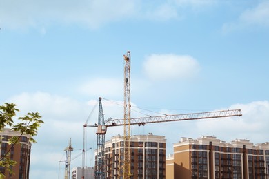 Construction site with tower crane near building