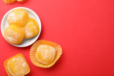 Delicious mochi on red background, flat lay with space for text. Traditional Japanese dessert