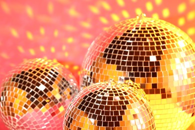 Photo of Many shiny disco balls indoors, color toned